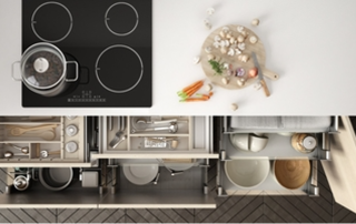 organized kitchen drawers filled with cooking utensils and cutlery