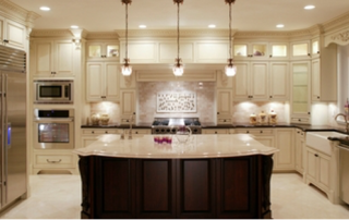 well-lit modern farmhouse kitchen with a datk wood kithcen island and white countertops