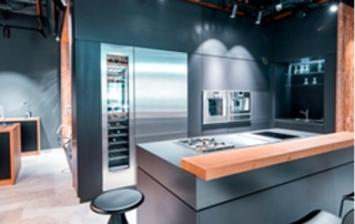 modern kitchen with an island and bar stools