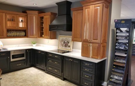 light wood overhead cabinets and dark wood countertop cabinets