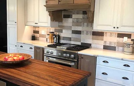 white kitchen cabinets with a butcher block island