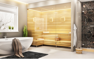 a modern bathroom with a standalone soaking tub and glass shower