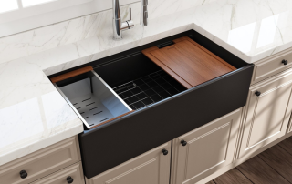 a farmhouse-style kitchen sink installed in a white countertop