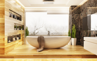 remodeled bathroom wth wood boards on the walls and a white soaking tub