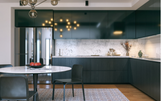 modern kitchen with flat, dark wood cabinets and a white countertop