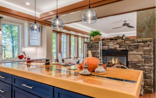 kitchen with butcher block island and blue cabinets