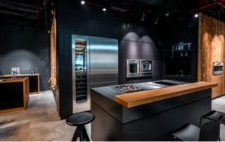 dark wood and black walls in a trendy, modern kitchen